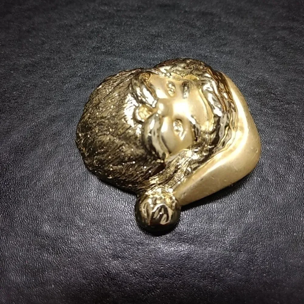 Gold tone vintage Santa Claus brooch